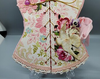 Álbum de fotos de corsé rosa y dorado