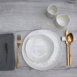 36 white porcelain plates and bowls. Set for 12 people: 12 dinner plates + 12 pasta bowls + 12 side plates. Handmade in Italy