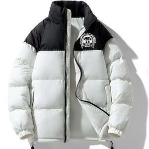 May include: A white and black puffer jacket with a zipper closure. The jacket has a black collar and a logo on the right side that says "Dread Threads".