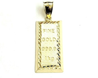 May include: A gold-colored pendant shaped like a gold bar with the words "FINE GOLD 999.9 1kg" engraved on it.