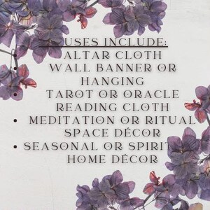 May include: A white rectangular textile featuring purple hydrangea floral borders and black text that reads: USES INCLUDE: ALTAR CLOTH, WALL BANNER OR HANGING, TAROT OR ORACLE READING CLOTH, MEDITATION OR RITUAL SPACE D&Eacute;COR, SEASONAL OR SPIRIT HOME D&Eacute;COR.