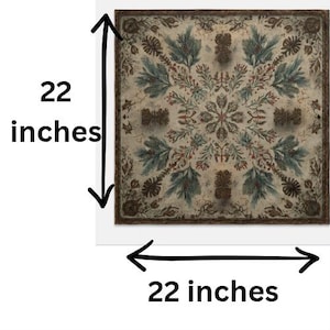 May include: A square textile featuring a symmetrical botanical pattern of green pine branches, brown pinecones, and red berries on a cream background. The fabric measures 22 inches by 22 inches, with a dark brown border framing the intricate design.