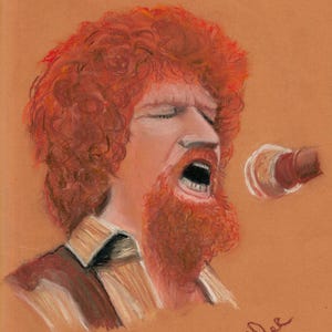 May include: A pastel portrait of a man with red curly hair and a matching beard, singing into a microphone. The artwork is set against a warm, orange-brown background. The man is wearing a collared shirt. Signed by R. Coldee.