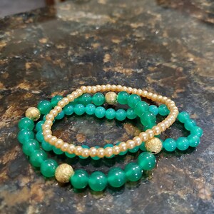 Green and gold stretch bracelets