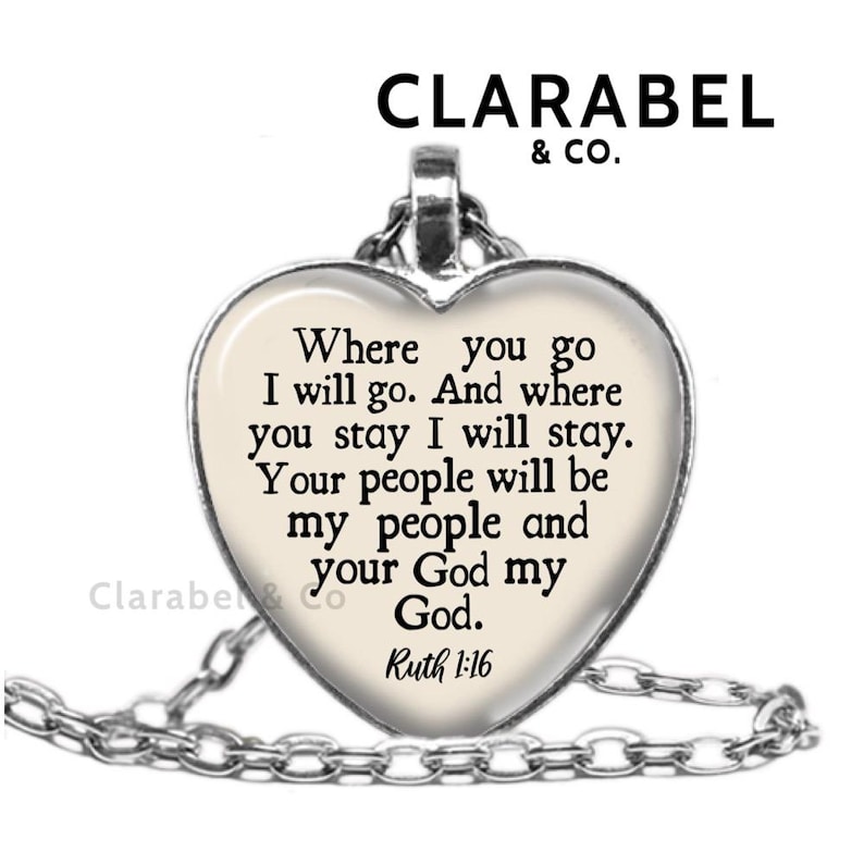 May include: A silver heart-shaped pendant necklace with a white background and black text that reads "Where you go I will go. And where you stay I will stay. Your people will be my people and your God my God. Ruth 1:16"
