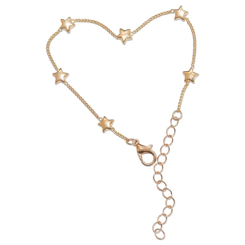 A gold-colored bracelet with small star-shaped charms attached to it.