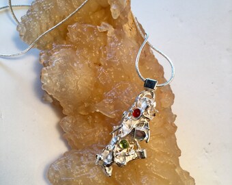 Brutalist silver pendant with peridot and carnelian