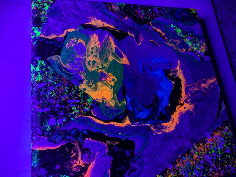 May include: Abstract painting with swirling patterns in shades of purple, blue, green, orange, and black. The painting has a vibrant, almost neon-like quality.
