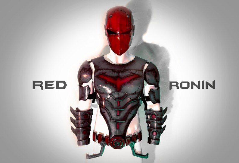 May include: Red Ronin costume armour with a red helmet and a black and red chest piece. The armour has a bat symbol on the chest.