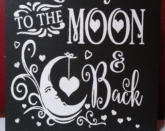 I love you to the moon and back wooden sign.