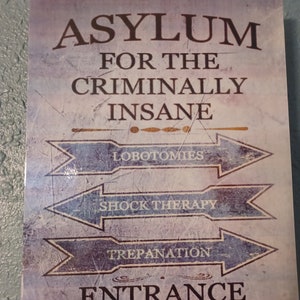 Asylum for the criminally insane sign.
