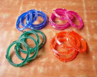 Set of 4 Kids plastic bangles made of plastic in blue, pink and green and orange colors