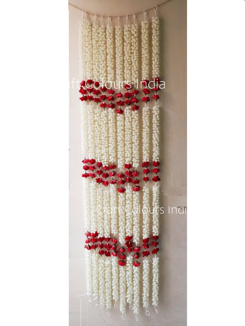 May include: White and red flower garland, with the text "Craft Colours India" visible in the image.
