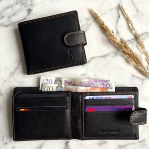 Cartera de cuero negro con seguridad RFID y cierre de lengüeta
