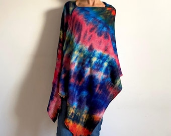 May include: A tie-dye poncho in shades of blue, pink, yellow, and orange. The poncho is made of a soft, lightweight fabric and has a relaxed fit.