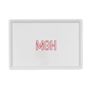 May include: White rectangular serving tray with a red outline of the letters "MGH" in the center.
