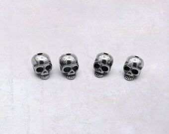 4 x Small Solid Stainless Steel Skull Beads 6mm x 8mm Centre Drilled