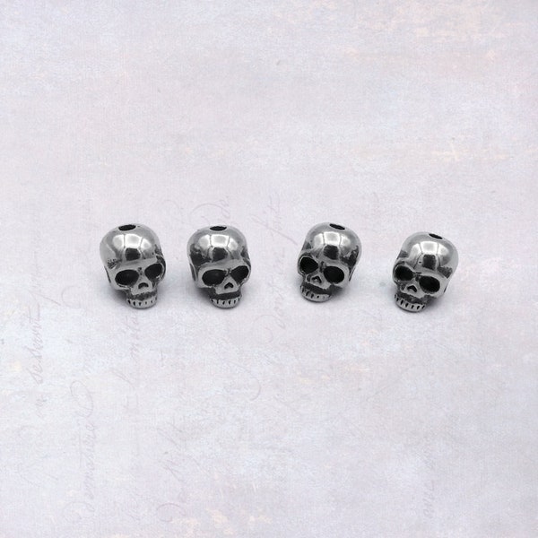 4 x Small Solid Stainless Steel Skull Beads 6mm x 8mm Centre Drilled