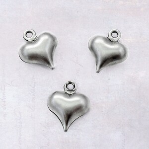 25 x Hollow Stainless Steel Small Puffy Heart Charm Drops