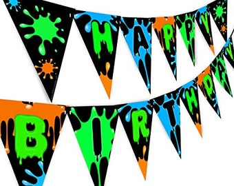 May include: A black and green happy birthday banner with paint splatters. The banner is made of triangular flags with the words "Happy Birthday" written in green letters.