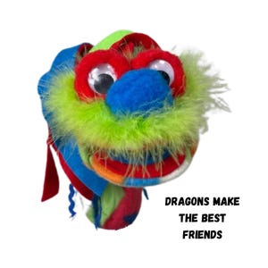 May include: A colorful dragon puppet with large googly eyes, a blue snout, and a green feathery mane. The dragon's head is made of felt in various colors, including red, blue, and green. Text on the image reads: DRAGONS MAKE THE BEST FRIENDS.