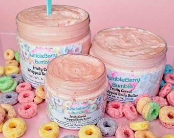 May include: Three clear plastic jars of pink whipped body butter with labels reading JumbleBerry Bumble Fruity Cereal Whipped Body Butter. A light blue plastic spoon is inserted into the largest jar, surrounded by colorful ring-shaped cereal pieces.