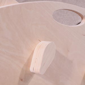 May include: A set of three ceramic mugs with a speckled, matte finish. The mugs are in shades of cream, light gray, and dark gray. Each mug has a simple, minimalist design, perfect for coffee or tea.