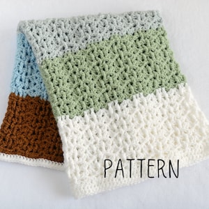 May include: A crocheted baby blanket with a striped pattern in shades of brown, blue, green, and white. The blanket has a "PATTERN" label on the bottom right corner.