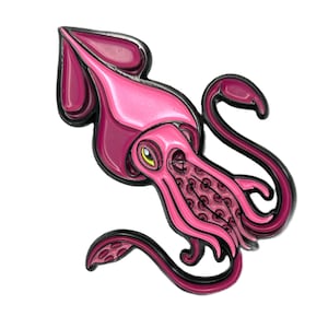 May include: Pink enamel pin of a squid with black outlines. The squid has a large head and tentacles with a detailed pattern.