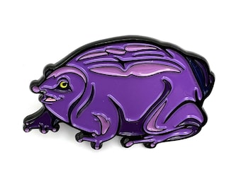 May include: Purple enamel pin of a cartoon frog with a textured back and a black outline.