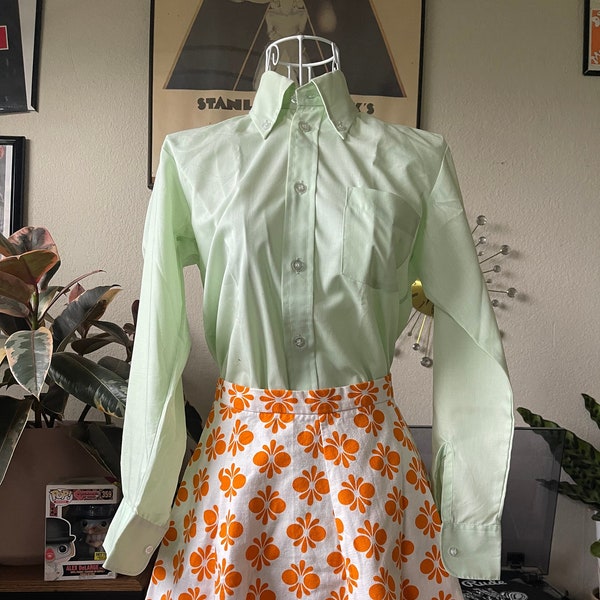 1960s vintage a-line orange and white flower pattern mini skirt