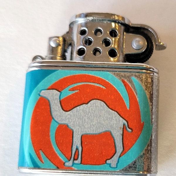 1997 Camel Mini Cigarette Lighter with Lift Arm. Lightly  Used. Orange & Green.  Needs fuel, flint