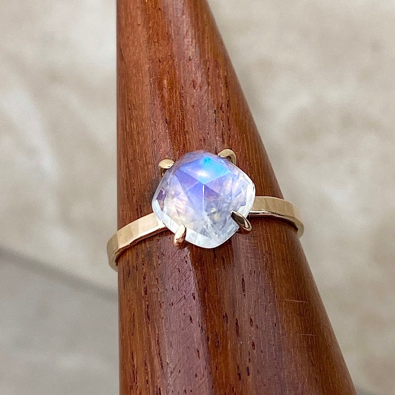 Stunning diamond cushion shape Moonstone ring set in high quality, precious metal hammered claw band. Options include 14k Rose Gold fill, 14k Yellow  Gold fill and 925 Sterling Silver. All metals are hypoallergenic and nickel free.