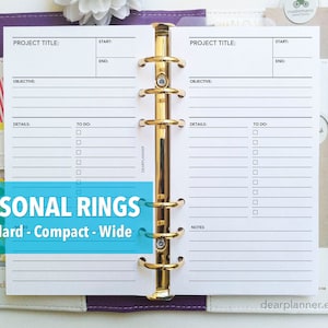 May include: A white planner page with gold rings. The page is divided into two columns. The left column has the headings "Project Title", "Objective", "Details", and "To Do". The right column has the headings "Project Title", "Objective", "Details", "To Do", and "Notes".