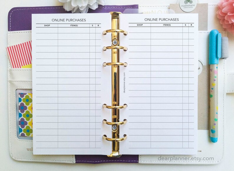 May include: A white printable planner page with the title "Online Purchases" and columns for "Shop", "Items", "S", and "R". The page is in a purple and white planner.