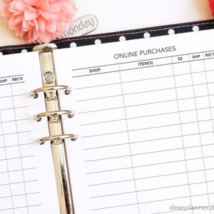 May include: A black and white planner with a polka dot cover and a silver binder. The planner has a page for tracking online purchases with columns for shop, items, price, shipping, and received.
