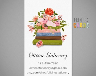 May include: Contact cards with a floral design. The cards feature a stack of books topped with a bouquet of pink, red, and peach flowers. The text "Olivine Stationery" and contact information are displayed.