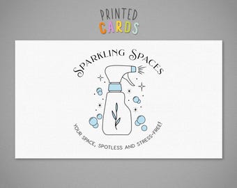 May include: A white business card with a black and blue illustration of a spray bottle with the text "Sparkling Spaces" above the bottle and "Your space, spotless and stress-free!" below the bottle. The text "OLIVINE STATIONERY" is at the bottom of the card.