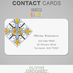 May include: White contact card with a decorative floral design in blue, yellow, and orange. The card includes the text "Olivine Stationery", a phone number, address, and the words "CONTACT CARDS" and "PRINTED CARDS".