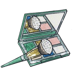 May include: A green and silver makeup palette with a brush. The palette is open and has a variety of colors inside. The brush is made of gold and silver sequins.