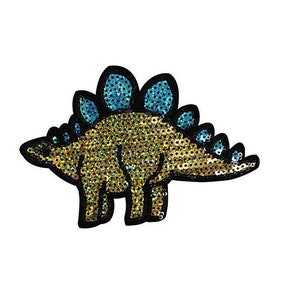 May include: A sequined dinosaur patch in a side profile. The dinosaur is outlined in black, with a body of gold and green sequins. The plates on its back are teal sequins. The patch is on a white background.