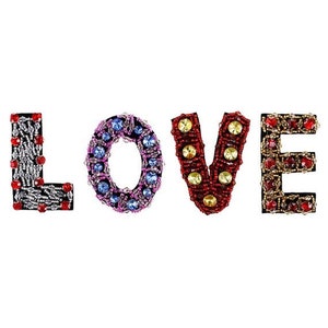 May include: The word "LOVE" spelled out in decorative letters. The letters are embellished with beads and jewels in various colors, including red, silver, blue, and gold. The letters are set against a white background.