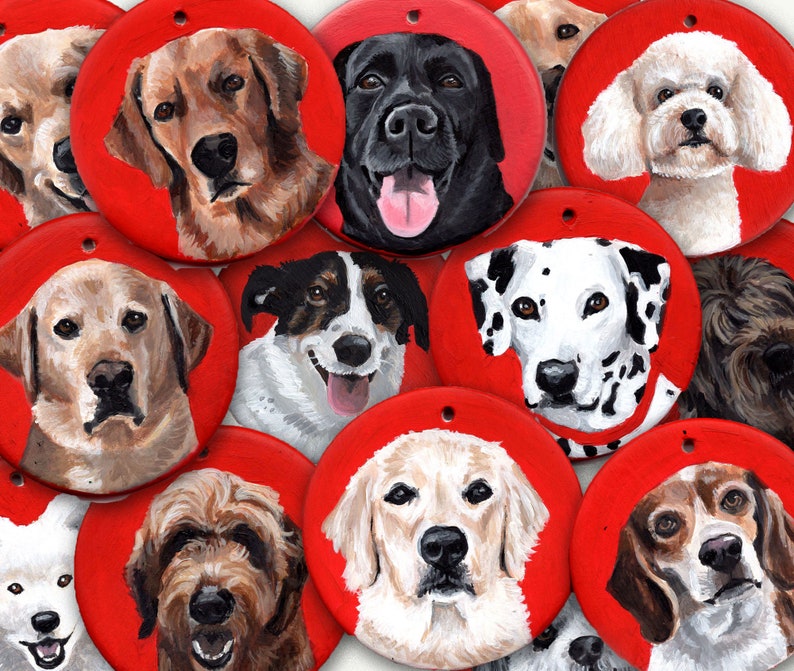 May include: A collection of 12 round red ornaments with painted portraits of dogs. Each ornament features a different breed of dog with a unique expression.