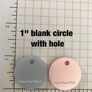 May include: Two 1-inch blank circles with holes, one pale pearl blue and one pale pearl pink. Text reads "1" blank circle with hole". The text "Etch n' Scratch Laser Cutting & Engraving" is also visible.