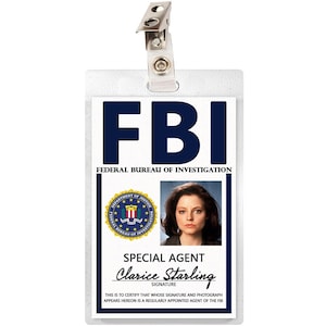 May include: A white plastic FBI identification card with a blue FBI logo, a photo of a woman, and the text "SPECIAL AGENT Clarice Starling".