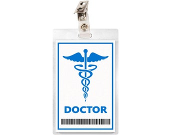 May include: White plastic badge holder with a blue medical symbol and the word "DOCTOR" printed on it. The badge holder has a silver clip at the top.