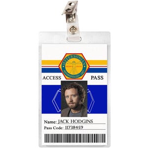 May include: A white plastic ID card with a blue and yellow design. The card has the text "ACCESS PASS" and a photo of a man with brown hair and a beard. The text "Name: JACK HODGINS" and "Pass Code: 11738459" is printed on the card.