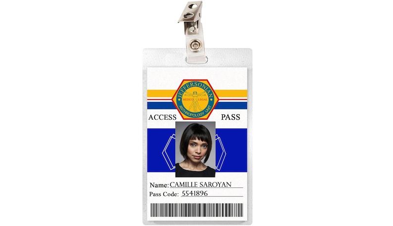 May include: A white plastic ID card with a blue and yellow background. The card has a logo for the Jeffersonian Institute, a photo of a woman, and the text "ACCESS PASS". The card also includes the name "CAMILLE SAROYAN" and the pass code "5541896".