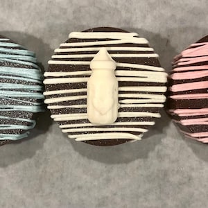Baby shower Oreos, pink Oreos, blue Oreos, baby bottle Oreos, baby boy,baby girl, chocolate Oreos, golden Oreos, white Oreos, flower Oreos