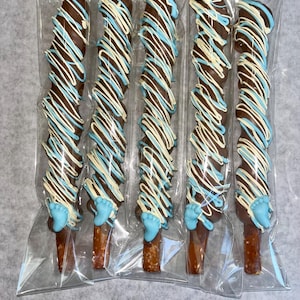 Chocolate pretzels, blue pretzels, Baby Shower pretzels, baby’s brewing, yellow pretzels, baby feet pretzels, baby boy, birthday pretzels